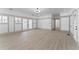 Spacious living room with sleek wood floors, natural light, and paneled walls at 1330 Cherry Ne St, St Petersburg, FL 33701