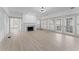 Open-concept living room featuring a fireplace and ample natural light at 1330 Cherry Ne St, St Petersburg, FL 33701