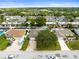 Bird's-eye view of the house, displaying the roof, driveway, and surrounding landscape at 13841 89Th Ave, Seminole, FL 33776