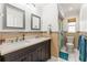 Bathroom with dual sinks, modern vanity, and decorative tile accents at 13841 89Th Ave, Seminole, FL 33776