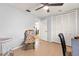 Bright bedroom featuring a ceiling fan, tile flooring, and closet with bi-fold doors at 13841 89Th Ave, Seminole, FL 33776