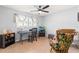 The bedroom has a ceiling fan, desk, and rocking chair at 13841 89Th Ave, Seminole, FL 33776