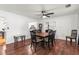 Charming dining room with hardwood floors, ceiling fan, and vintage-style furnishings at 13841 89Th Ave, Seminole, FL 33776