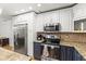 This kitchen has stainless steel appliances, granite countertops, and two-toned cabinetry at 13841 89Th Ave, Seminole, FL 33776
