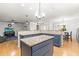 Kitchen with granite countertops, island, stainless steel appliances, and breakfast bar at 13841 89Th Ave, Seminole, FL 33776
