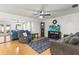 Open living room with hardwood floors, ceiling fan, and comfortable seating at 13841 89Th Ave, Seminole, FL 33776