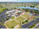 Bird's eye view of community amenities including recreational activities, outdoor spaces, and parking at 1402 Bluewater Dr, Sun City Center, FL 33573