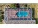 Aerial view of the screened-in pool and patio area, showcasing its layout and design at 1402 Bluewater Dr, Sun City Center, FL 33573