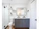 Modern bathroom with a double vanity, sleek fixtures, and glass-enclosed shower, providing a spa-like experience at 1402 Bluewater Dr, Sun City Center, FL 33573