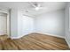 Bedroom featuring laminate floors, white walls, white trim, and a closet at 1402 Bluewater Dr, Sun City Center, FL 33573