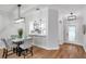 Dining area provides a view to the front entry and well lit kitchen at 1402 Bluewater Dr, Sun City Center, FL 33573