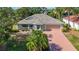 Charming single-story home with a well-maintained lawn, mature landscaping, and a two-car garage at 1402 Bluewater Dr, Sun City Center, FL 33573