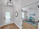Inviting foyer flows into a bright home office with desk and neutral decor at 1402 Bluewater Dr, Sun City Center, FL 33573