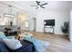 Bright open living room featuring wood laminate flooring and vaulted ceilings at 1402 Bluewater Dr, Sun City Center, FL 33573