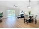 Open-concept living area with pool view, modern furnishings, and natural light at 1402 Bluewater Dr, Sun City Center, FL 33573