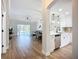 Open concept living spaces featuring the kitchen, living room and dining area and access to the pool at 1402 Bluewater Dr, Sun City Center, FL 33573
