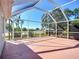 Large screened-in porch, perfect for enjoying outdoor living while being protected from the elements at 1402 Bluewater Dr, Sun City Center, FL 33573