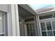 Covered outdoor patio area with screening at 1803 Longview Ln, Tarpon Springs, FL 34689