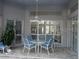 Outdoor patio area features an outdoor table and chairs at 1803 Longview Ln, Tarpon Springs, FL 34689
