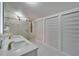 Modern bathroom featuring a double vanity, spacious glass shower, and sleek, storage drawers at 18852 Tracer Dr, Lutz, FL 33549