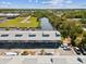 Aerial view of waterfront townhomes, showing ample parking and canal access at 200 Meres Blvd # 26, Tarpon Springs, FL 34689