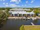 Aerial view of townhomes on the water with boat docks and private balconies at 200 Meres Blvd # 26, Tarpon Springs, FL 34689