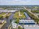 Breathtaking aerial view of waterfront condos with private docks and scenic canals, offering a unique waterfront lifestyle at 200 Meres Blvd # 26, Tarpon Springs, FL 34689