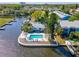 Waterfront home featuring a private backyard pool surrounded by lush landscaping at 200 Meres Blvd # 26, Tarpon Springs, FL 34689