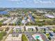 Waterfront condominium complex featuring private boat docks and serene waterways with clear blue skies above the community at 200 Meres Blvd # 26, Tarpon Springs, FL 34689