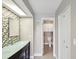 Charming bathroom with a modern vanity, sleek sink, and tiled accent wall at 200 Meres Blvd # 26, Tarpon Springs, FL 34689