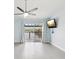 Bright bedroom with a view of the river, ceiling fan, and sliding glass doors to a private balcony at 200 Meres Blvd # 26, Tarpon Springs, FL 34689