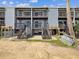 Exterior rear view of condo showing steps and walkways at 200 Meres Blvd # 26, Tarpon Springs, FL 34689