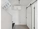 Hallway featuring storage and an access ladder at 200 Meres Blvd # 26, Tarpon Springs, FL 34689