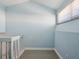 Hallway featuring an open, airy space, wood-look flooring, and natural light from the window at 200 Meres Blvd # 26, Tarpon Springs, FL 34689
