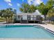 Beautiful community pool on the water with nearby deck at 200 Meres Blvd # 26, Tarpon Springs, FL 34689