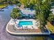 Waterfront home featuring a private backyard pool surrounded by lush landscaping at 200 Meres Blvd # 26, Tarpon Springs, FL 34689