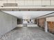 Spacious undercarriage parking area with storage space and brick paver flooring at 200 Meres Blvd # 26, Tarpon Springs, FL 34689