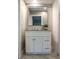 Bathroom featuring a vanity with cabinets and drawers, and decorative modern lighting at 208 Villa Dr # 208, Osprey, FL 34229