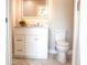 Bathroom featuring a vanity with white cabinets, stone countertop, and modern lighting at 208 Villa Dr # 208, Osprey, FL 34229