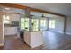 Modern kitchen featuring granite countertops and stainless steel appliances, seamlessly integrated into the living space at 208 Villa Dr # 208, Osprey, FL 34229