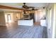 Spacious living room features an open floor plan and modern kitchen with granite countertops at 208 Villa Dr # 208, Osprey, FL 34229