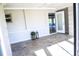 Bright sunroom featuring tile flooring and an open entryway to another room at 208 Villa Dr # 208, Osprey, FL 34229