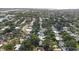 An aerial view of a beautiful neighborhood with lush green trees and well-maintained homes at 2244 Glenmoor N Rd, Clearwater, FL 33764