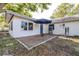 Backyard patio with brickwork, patio umbrella, and a cozy outdoor space at 2244 Glenmoor N Rd, Clearwater, FL 33764