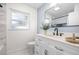 Well-lit bathroom with white vanity and plenty of natural light at 2244 Glenmoor N Rd, Clearwater, FL 33764