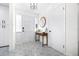 Bright foyer features patterned tile flooring and a decorative table, creating a stylish entrance at 2244 Glenmoor N Rd, Clearwater, FL 33764