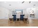 Well-designed kitchen featuring a large island with bar stools and modern stainless steel appliances at 2244 Glenmoor N Rd, Clearwater, FL 33764