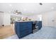 Kitchen island with stylish blue cabinets and drawers, and stainless steel oven at 2244 Glenmoor N Rd, Clearwater, FL 33764