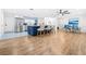 Modern open kitchen with a blue island, seating, and stainless steel appliances at 2244 Glenmoor N Rd, Clearwater, FL 33764