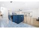 Stylish kitchen island featuring blue cabinets, stainless steel appliances, and tiled flooring at 2244 Glenmoor N Rd, Clearwater, FL 33764